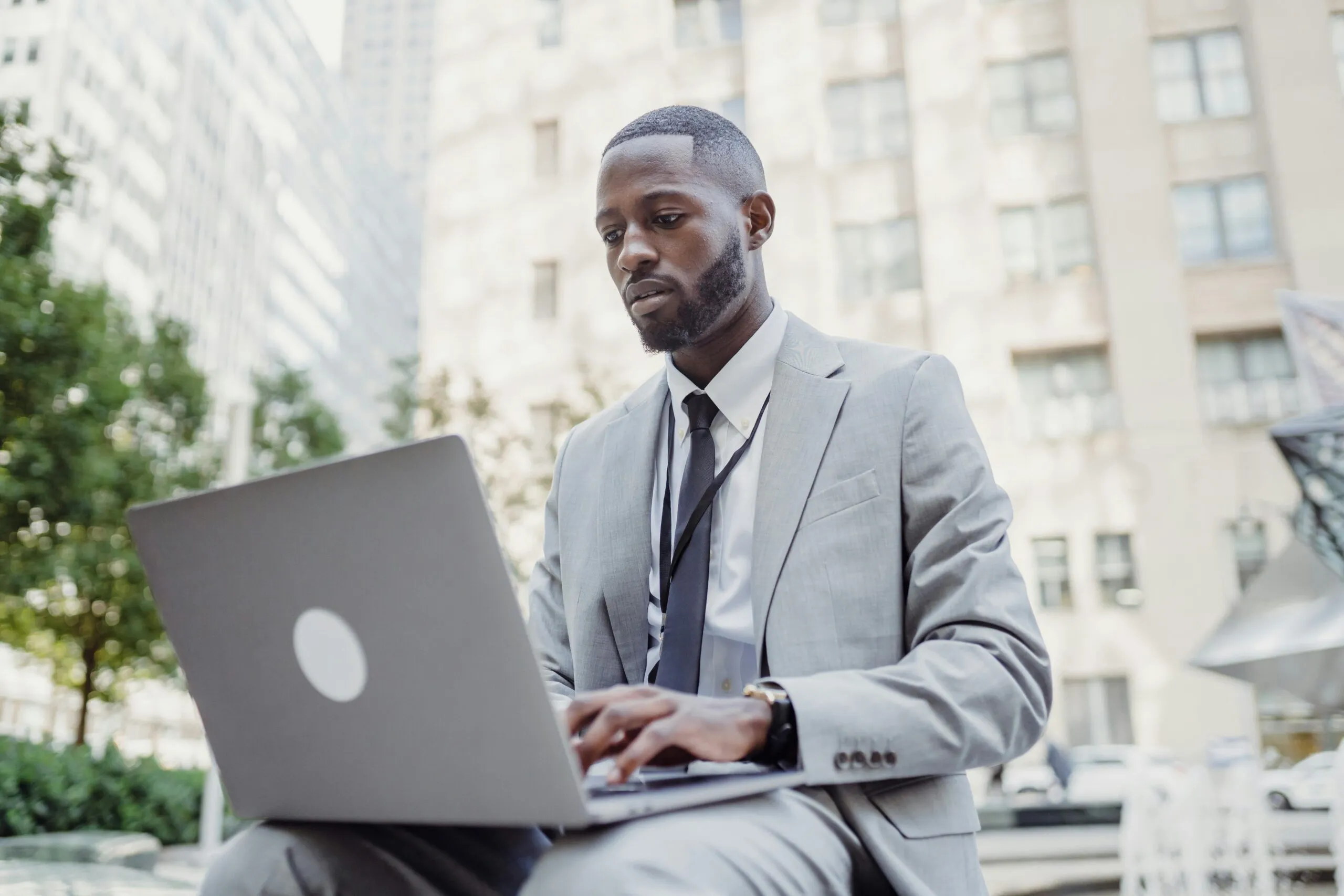 Business owner working remotely with a virtual assistant on screen, symbolizing Timber Creek Virtual’s role in scaling businesses without traditional overhead expenses.