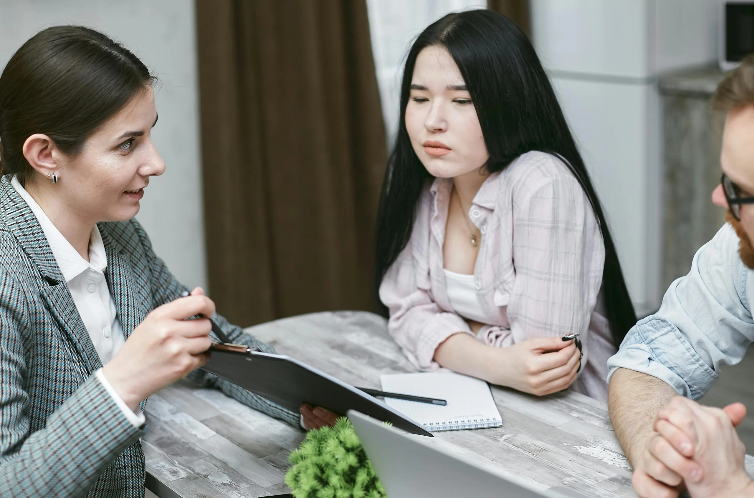 Real estate agent reviewing closing checklist and documents digitally, representing Timber Creek Virtual transaction coordination services that streamline timelines, improve accuracy, and support faster, smoother property closings for all parties.