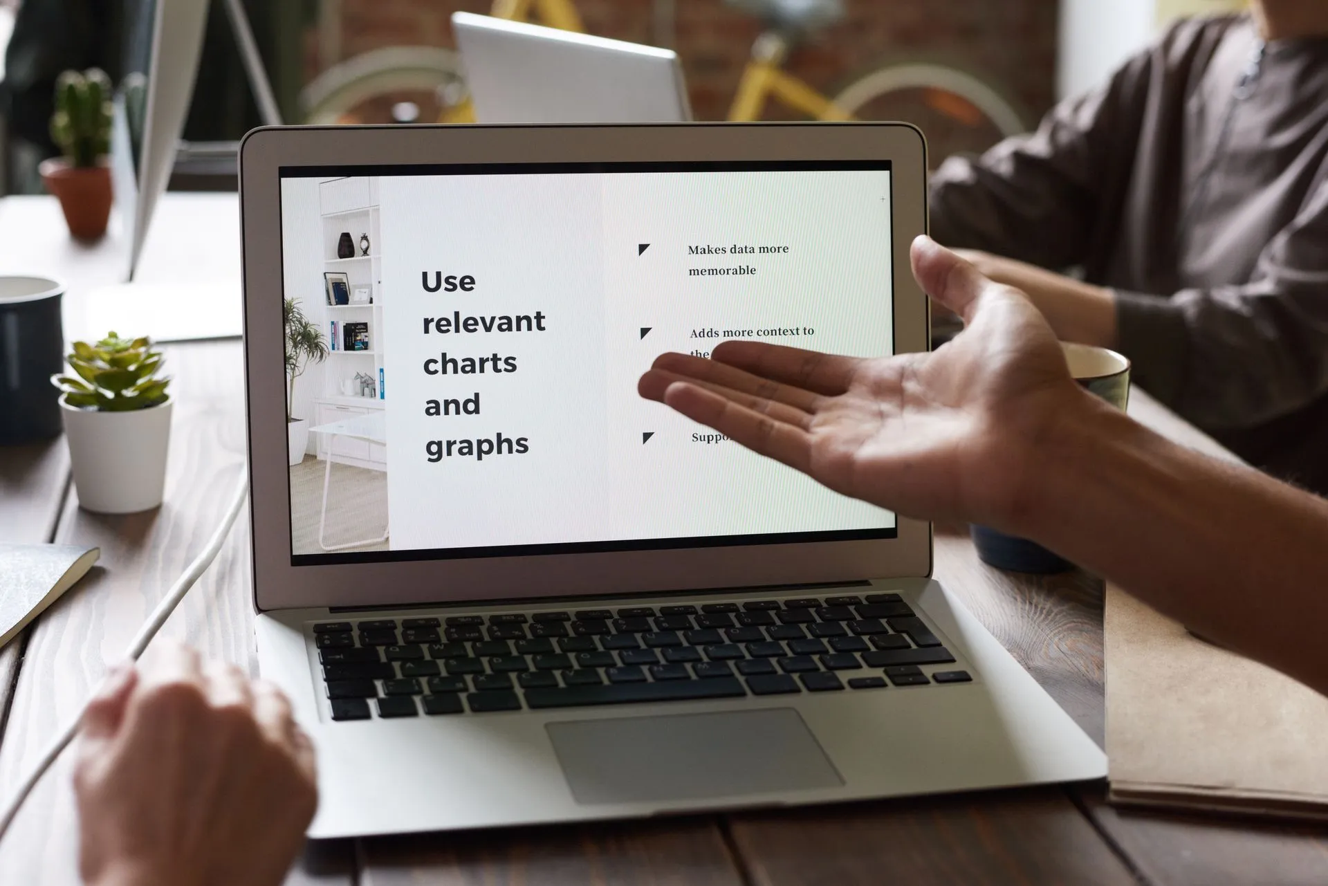 Marketer and AI-powered computer collaborating on social media content creation.
