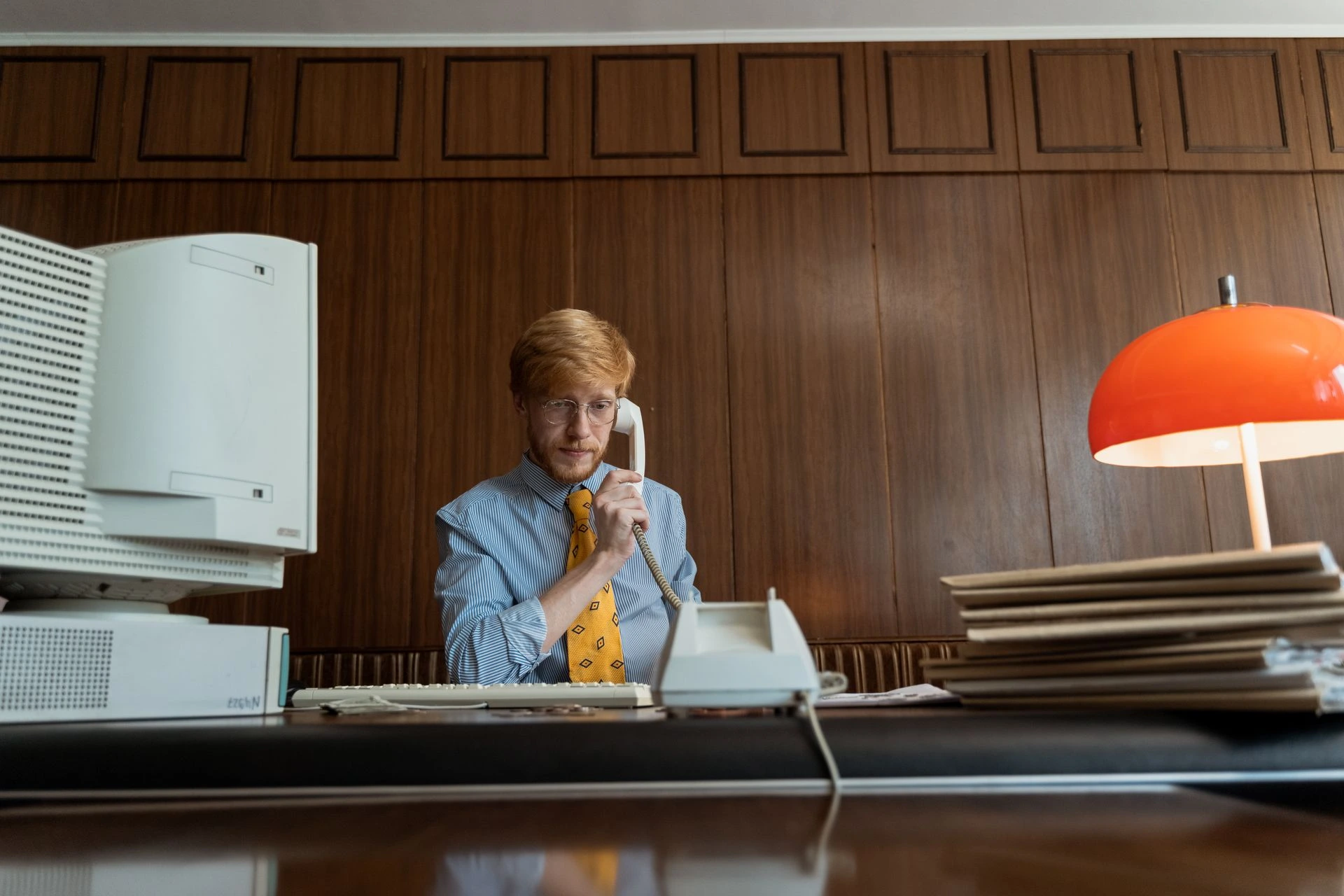 Virtual Assistant collaborating with business team in an office setting.