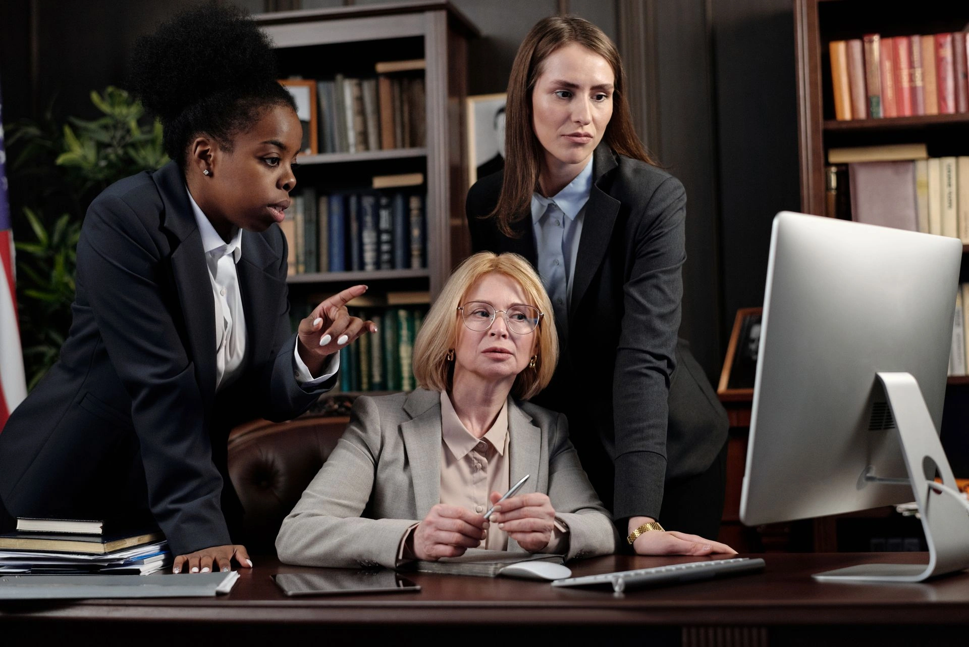 Virtual Executive Assistant working with an executive team on a video call.